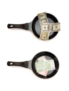 Two Frying Pans With Dollar And Euro Bills Stock Photos Two Frying Pans With Dollar And Euro Bills Stock Photos