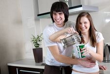 Boy And Beautiful Girl With Cup And With Teapot Stock Image