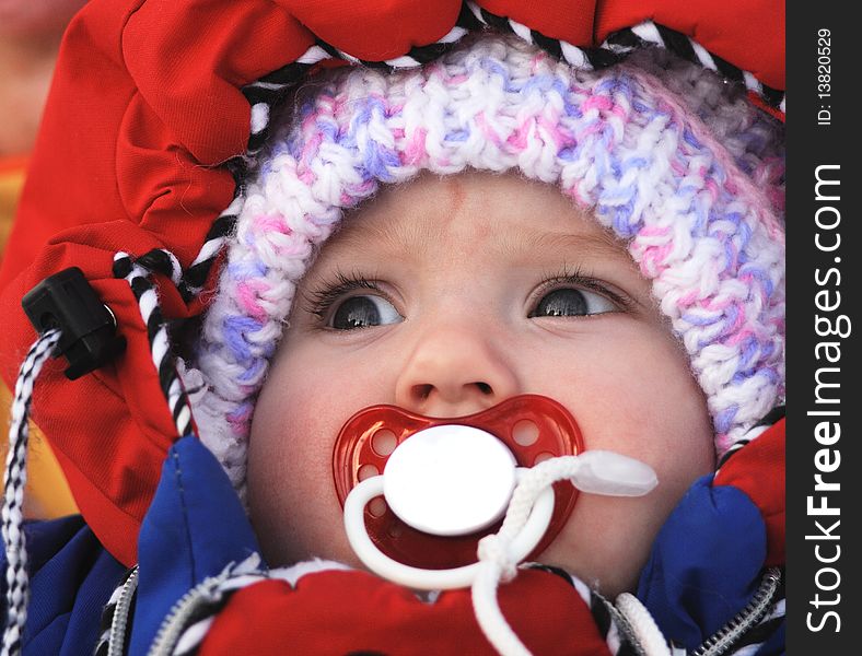 Beautiful baby with baby's dummy