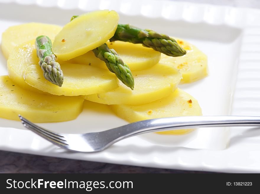 Cooked potatoes with green asparagus. Cooked potatoes with green asparagus