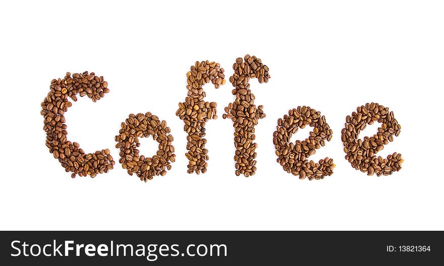 Inscription from coffee grains on a white background