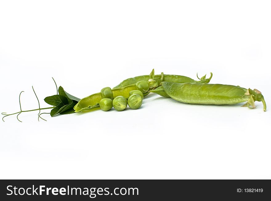 Fresh green pea in the pod with flowers isolated on white