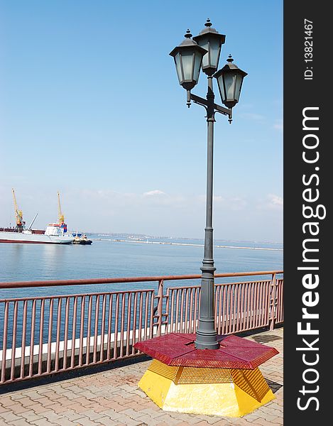 A lantern at the pier on the shore of the Black Sea. A lantern at the pier on the shore of the Black Sea