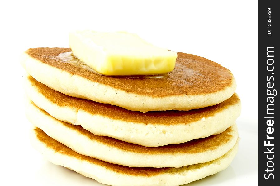 Stack of plain pancakes with butter