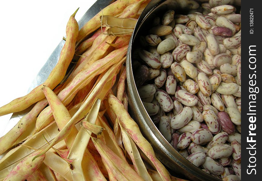 Close up of spotted white kidney beans with the pea pods. Close up of spotted white kidney beans with the pea pods.