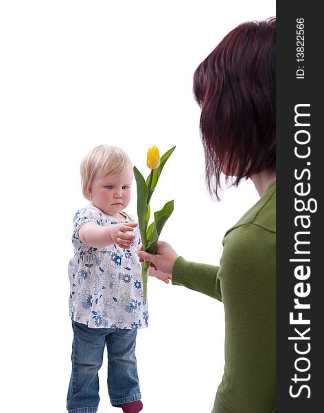 Child gives her mother flowers for Mothers Day