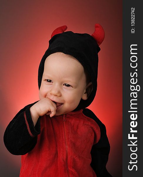 Cute child in costume Little devil