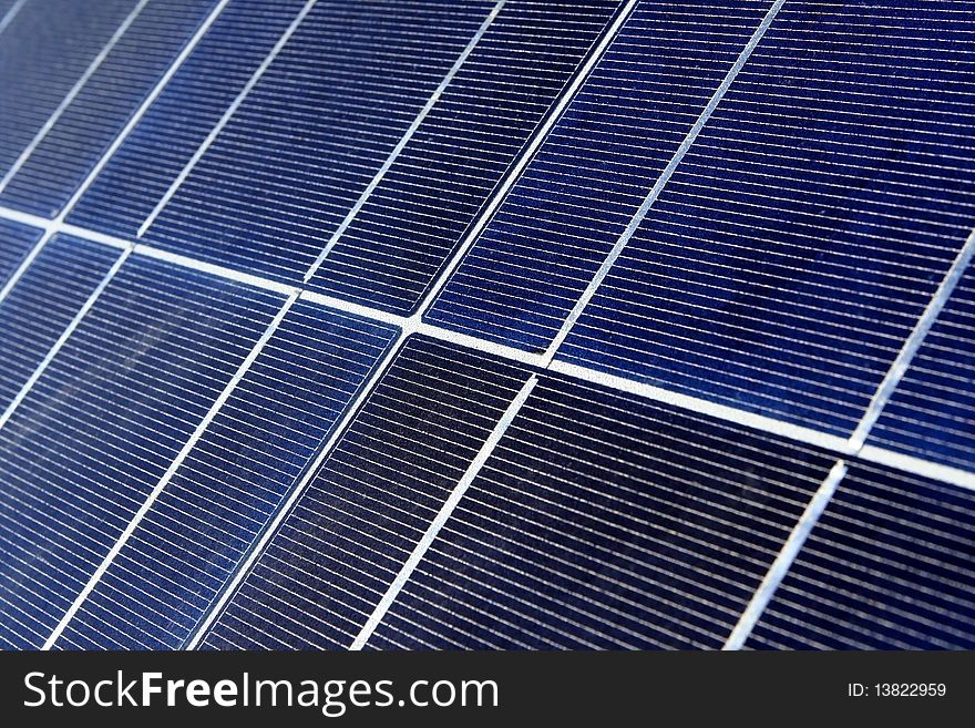 Modern solar photo voltaic panel close up with great blue cells details in a perspective view. Great for energy and environment themes.