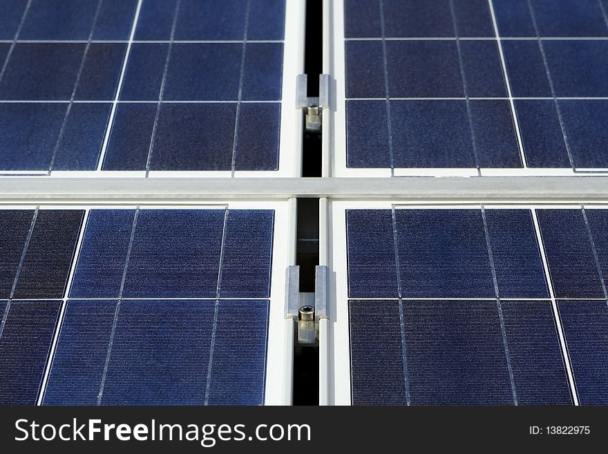 Modern solar photo voltaic panel close up with great blue cells details in a perspective view. Great for energy and environment themes.