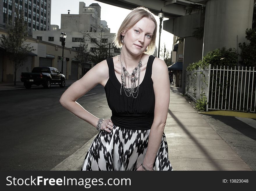 Attractive woman posing in a city setting. Attractive woman posing in a city setting