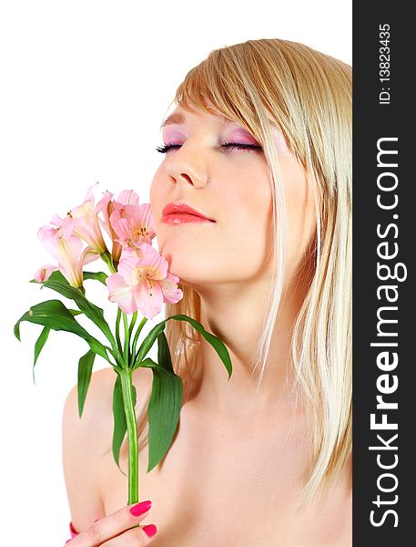 Portrait of a woman holding pink flowers over white background