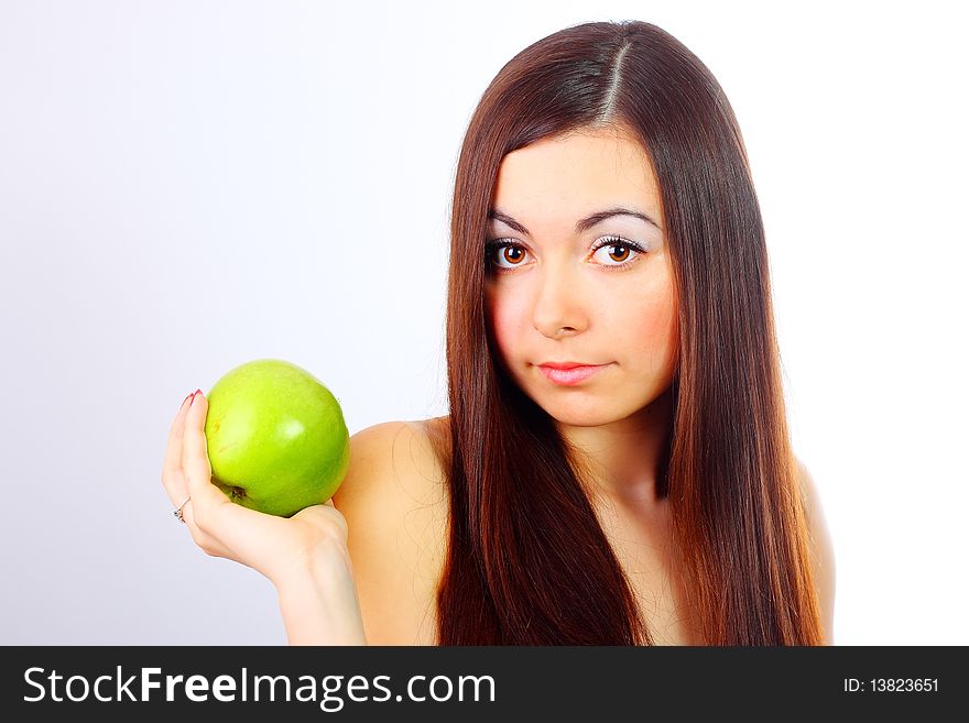 Young girl holding a green apple. Young girl holding a green apple