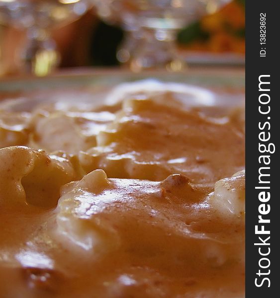 Plate of Italian pasta - ravioli filled with mushrooms, in a cream and walnut sauce,  served in a restaurant