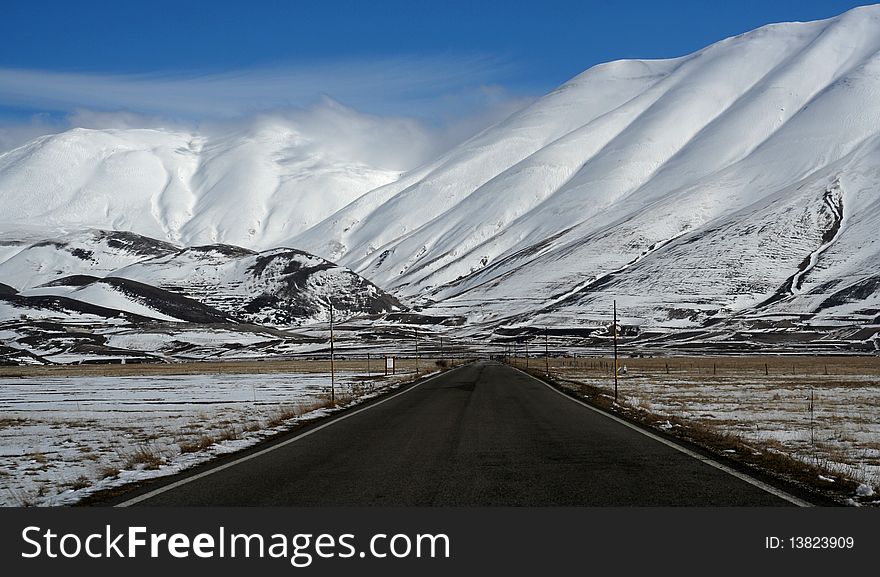 Mountain road panorama captured in Castelluccio di Norcia. Mountain road panorama captured in Castelluccio di Norcia