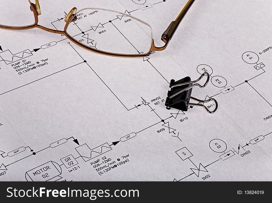Technical blueprint drawing closeup with glasses. Technical blueprint drawing closeup with glasses