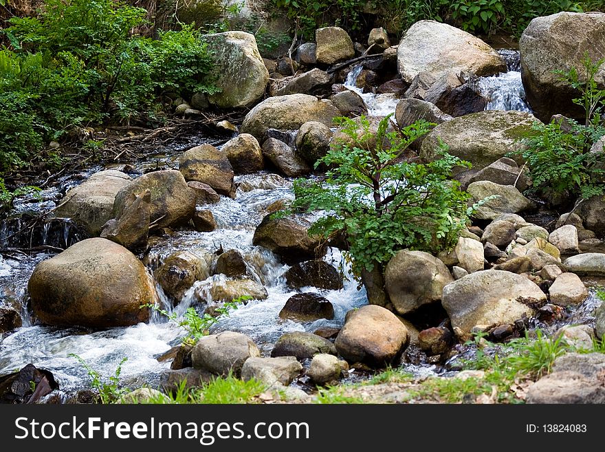 A little beautiful river in the mountains .