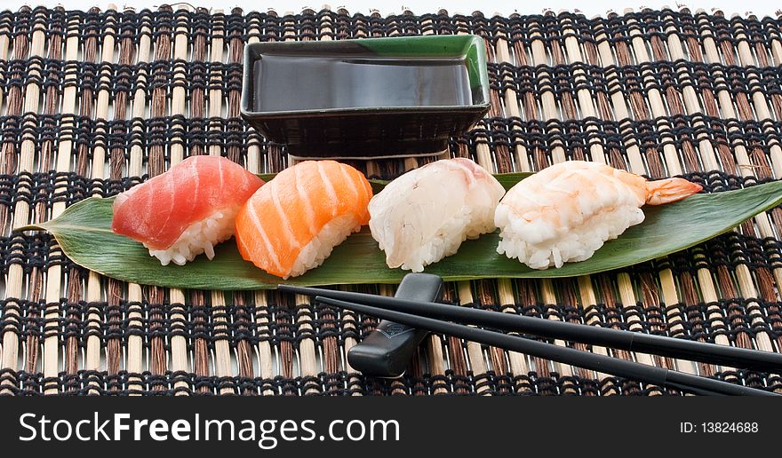 Sushi, japanese cuisine. variuous pieces on a leaf. Sushi, japanese cuisine. variuous pieces on a leaf
