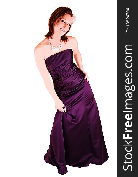 An beautiful young woman in an burgundy long evening gown standing in the studio, looking into the camera, for white background. An beautiful young woman in an burgundy long evening gown standing in the studio, looking into the camera, for white background.