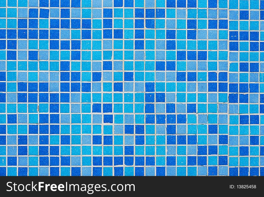 Detail of a blue mosaic wall pattern. Detail of a blue mosaic wall pattern