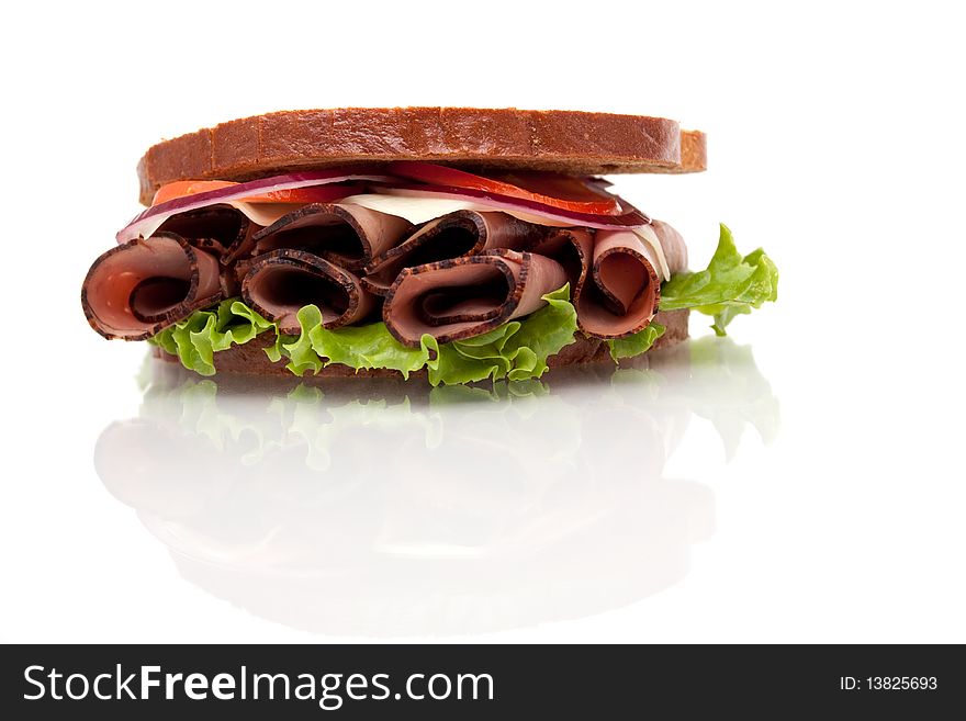 Delicious roast beef sandwich with rye bread on white background. Delicious roast beef sandwich with rye bread on white background