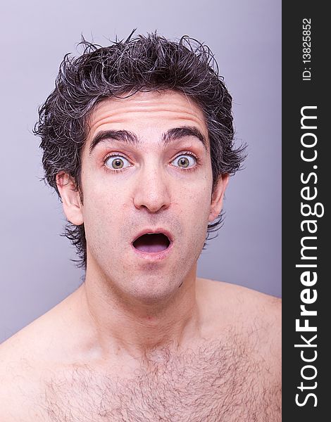 Young male with surprised or shocked facial expression. Young male with surprised or shocked facial expression