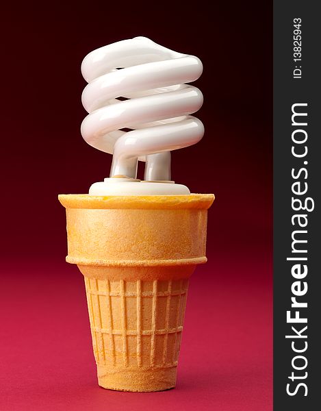 A compact fluorescent bulb in an ice cream cone