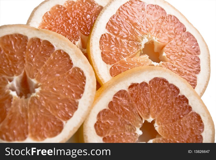 Cut slices of ripe, juicy fresh oranges. Isolation on white background.