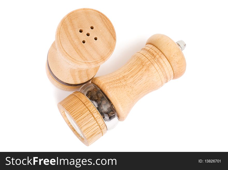 Wooden saltcellar and mill for pepper over white