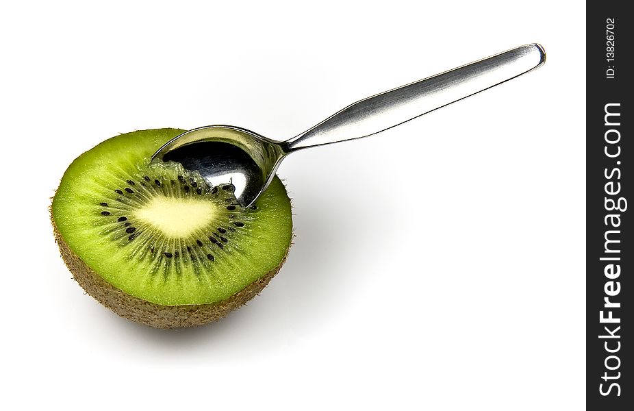 Kiwi tropical fruit and spoon isolated on white background. Kiwi tropical fruit and spoon isolated on white background