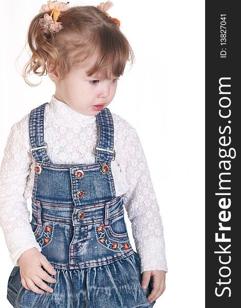 Portrait of the small beautiful girl on a white background. Portrait of the small beautiful girl on a white background