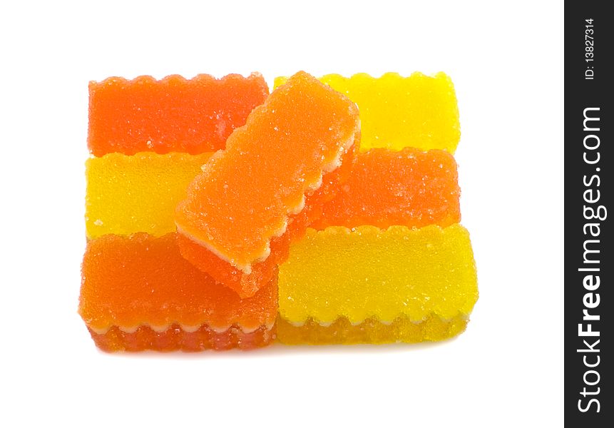 Yellow and orange fruit jelly on the white background