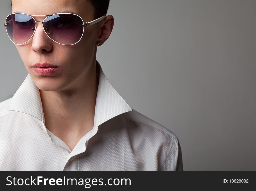 Portrait of young handsome man in sunglasses