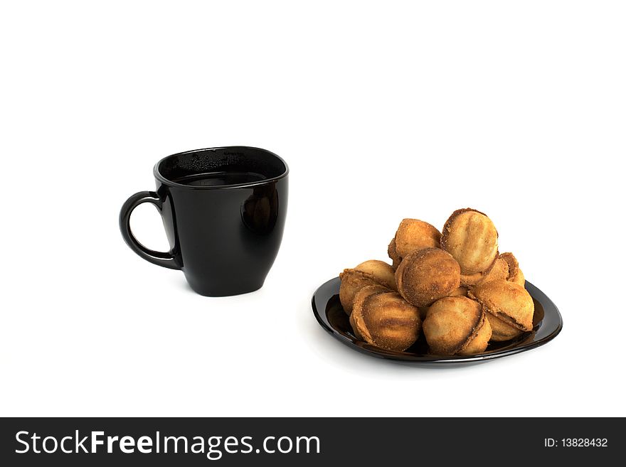 Nuts cookie and cup of tea isolated on white. Appetizing and tasty. Nuts cookie and cup of tea isolated on white. Appetizing and tasty.