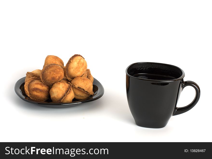 Nuts cookie and cup of coffee isolated on white. Appetizing and tasty. Nuts cookie and cup of coffee isolated on white. Appetizing and tasty.