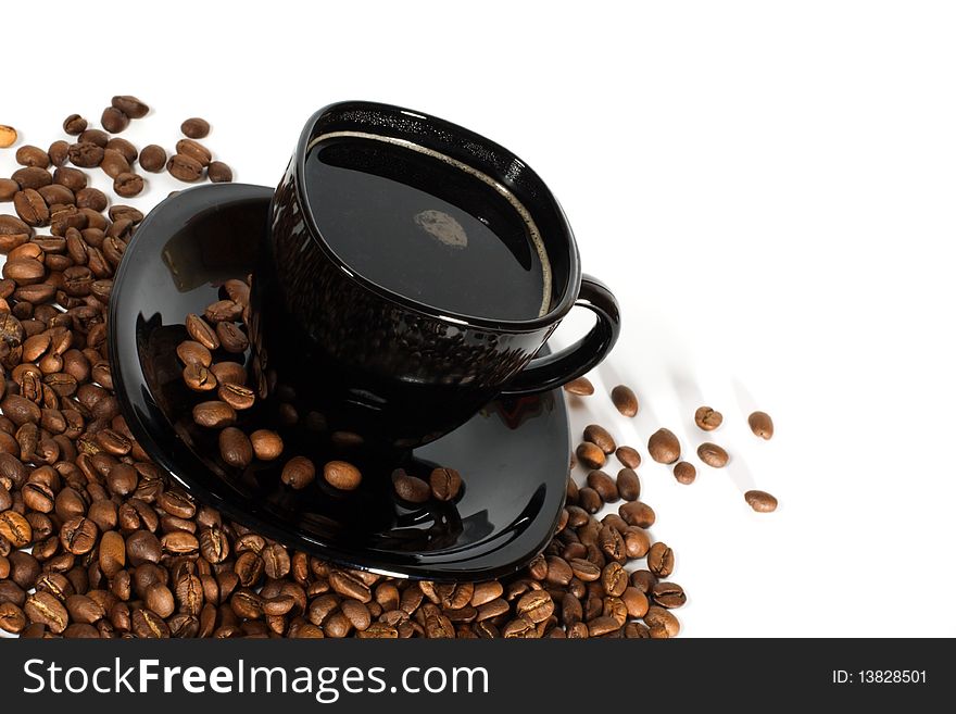 Black cup of coffee and coffee beans isolated on white background