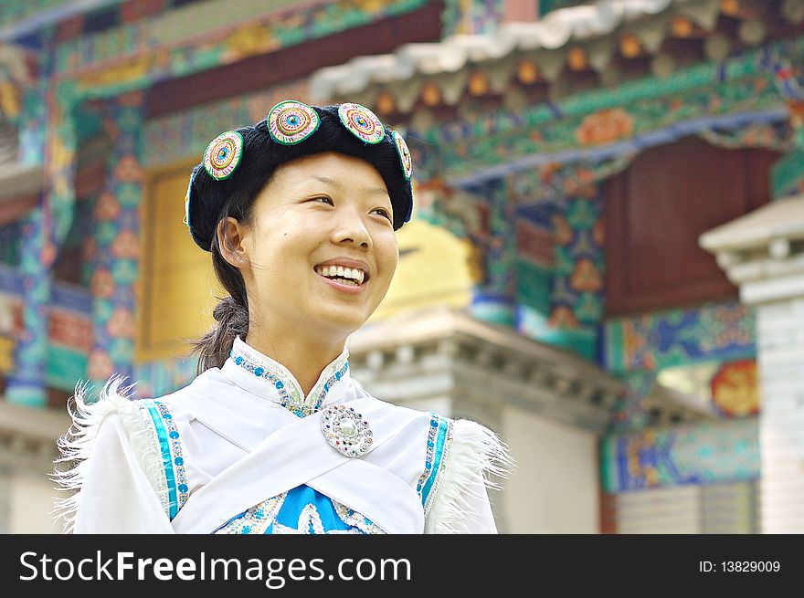 Pretty Chinese woman dressed in the traditional clothes of the Naxi minority culture. Pretty Chinese woman dressed in the traditional clothes of the Naxi minority culture