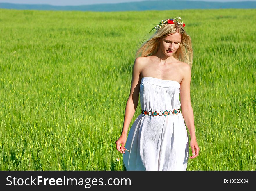 Young beautiful woman in traditional clothes on natural background. Young beautiful woman in traditional clothes on natural background