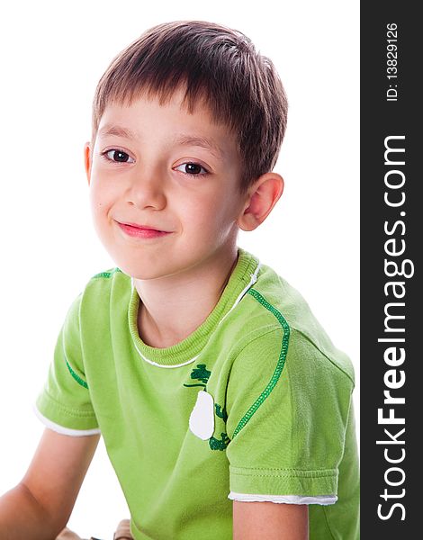 Little smiling boy in green t-shirt studio shot