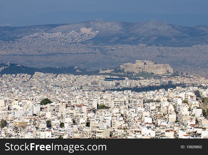 A high general view of the city o Athens, Greece. The Acropolis stands in the middle. A high general view of the city o Athens, Greece. The Acropolis stands in the middle