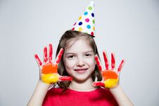 Girl In A Cap, Shows Palms In Paint Stock Image