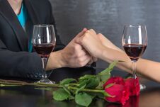 Modern Couple Hands On Restaurant Table With Two Glasses Of Red Wine And Roses Royalty Free Stock Photo Modern Couple Hands On Restaurant Table With Two Glasses Of Red Wine And Roses Royalty Free Stock Photo