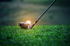 Blurred Golf Club And Golf Ball Close Up In Grass Field Stock Images