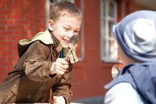 Two Boys Fighting With Spoons Stock Photography