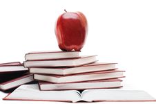 Stack Of Books And Apple Isolated Royalty Free Stock Photos