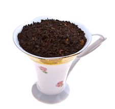 Selected Dry Black Tea Leaves In Beautifull Cup Stock Photos