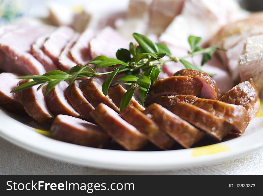 Closeup of sausage slices on the plate. Closeup of sausage slices on the plate