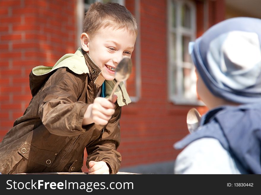 Two Boys Fighting With Spoons