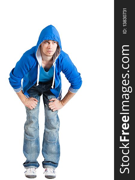 A handsome young man dressed in blue casual clothing with hood on looking up. Vertical shot. Isolated on white. A handsome young man dressed in blue casual clothing with hood on looking up. Vertical shot. Isolated on white.