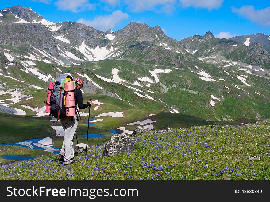 Hiker boy in Caucasus mountains