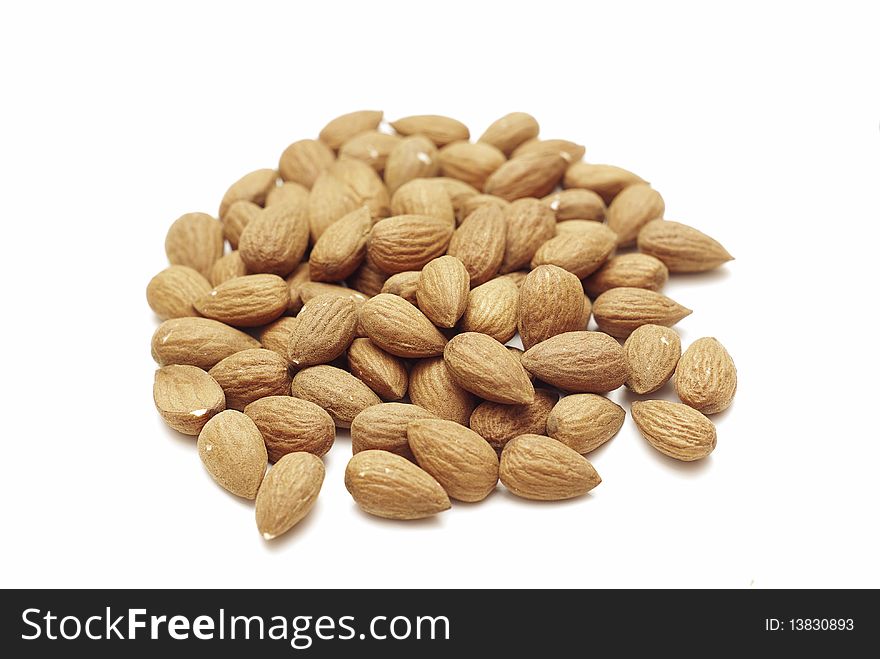 Pile of almonds isolated on the white background. Pile of almonds isolated on the white background